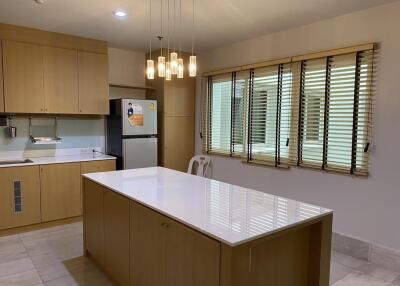 Spacious kitchen with modern appliances and central island