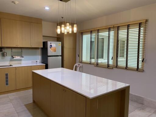 Spacious kitchen with modern appliances and central island