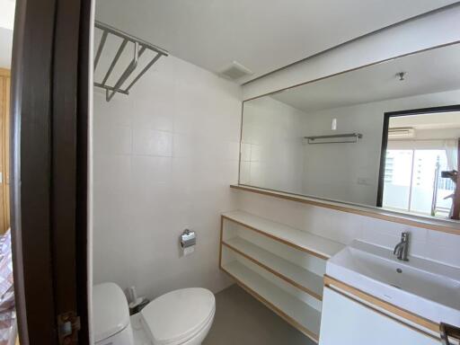 Spacious modern bathroom with ample shelving