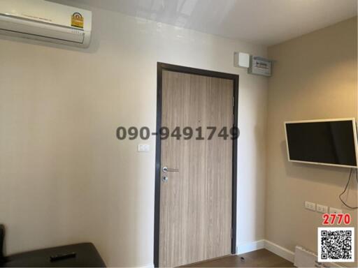 Compact bedroom with air conditioning and wall-mounted TV
