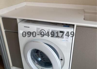 Modern laundry area with built-in Samsung washing machine