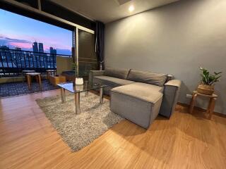 Spacious and well-furnished living room with city view