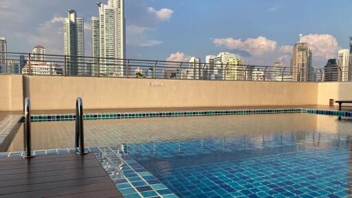 Rooftop swimming pool with city skyline view