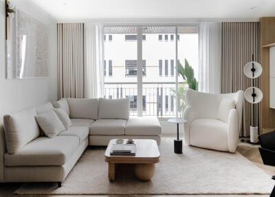 Modern and bright living room with comfortable seating and large windows