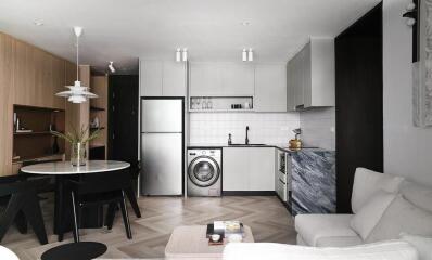 Modern kitchen with white cabinets and built-in appliances