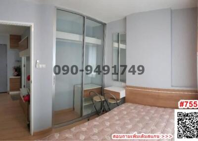 Spacious bedroom with large glass sliding door and tiled flooring