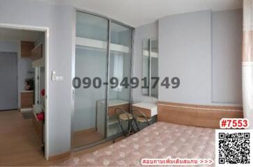 Spacious bedroom with large glass sliding door and tiled flooring