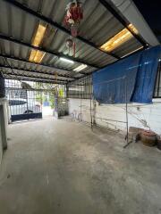 Spacious unfinished interior space with metal roofing and concrete flooring