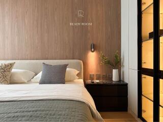 Modern bedroom with elegant decor and wooden accents