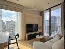 Modern living room with a view of the cityscape through floor-to-ceiling windows