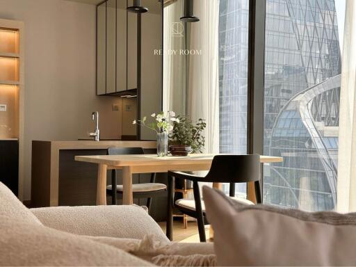 Cozy dining area with modern furniture and city view