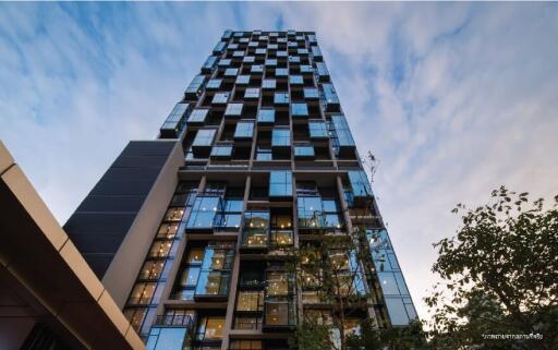 Modern high-rise residential building against a twilight sky