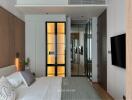 Modern bedroom with natural light and ensuite bathroom