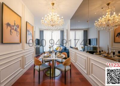 Elegant dining room with crystal chandeliers and art on walls