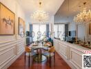 Elegant dining room with crystal chandeliers and art on walls