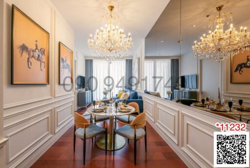 Elegant dining room with crystal chandeliers and art on walls