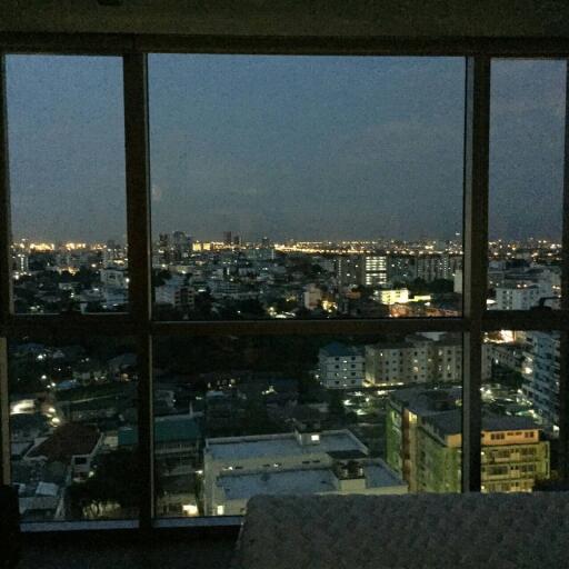 City view from a high-rise apartment at night