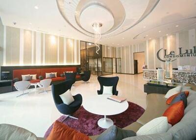 Spacious and modern lobby of a condominium with comfortable seating