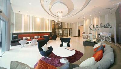 Spacious and modern lobby of a condominium with comfortable seating