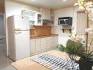 Modern kitchen with wooden cabinets and stainless steel appliances