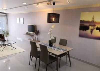 Modern living room with dining area and flat-screen TV