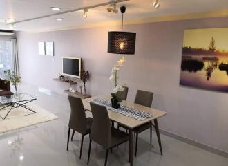 Modern living room with dining area and flat-screen TV