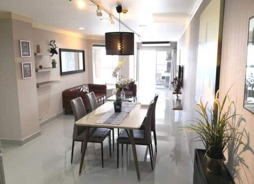 Spacious and well-lit living room with adjoining dining space