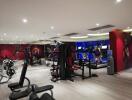 Modern gym with various exercise machines in a residential building