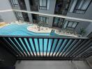 View of the condominium's communal swimming pool from a balcony