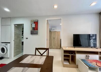 Modern living room with dining area and open layout connected to the kitchen