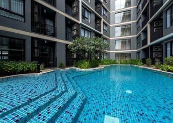 Modern apartment building with a communal swimming pool