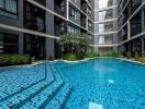 Modern apartment building with a communal swimming pool