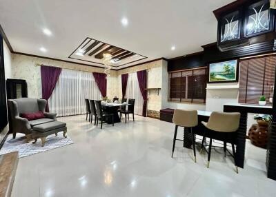 Spacious and elegantly decorated living room with dining area