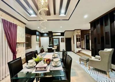 Elegant dining area with modern chandelier and sophisticated decor