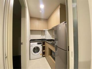 Compact laundry room with modern appliances