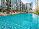 Modern residential apartment buildings with a shared swimming pool and leisure area