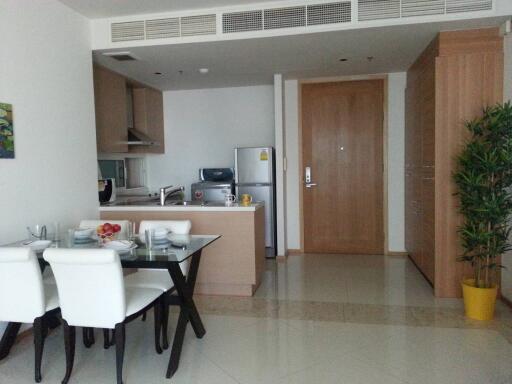 Modern kitchen with dining area and tiled floor in an apartment