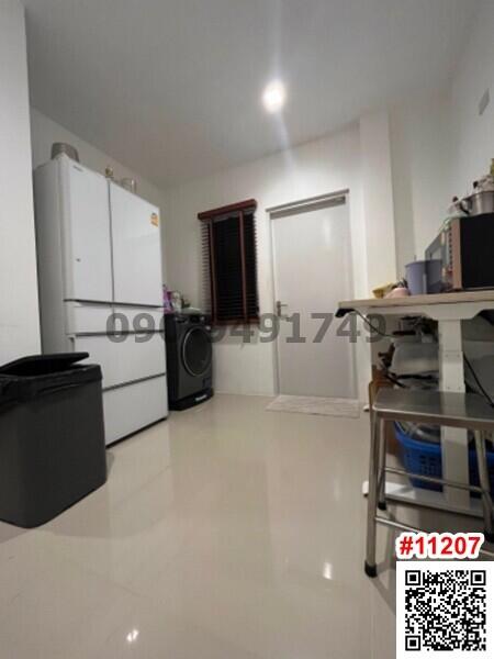 Compact kitchen with white appliances and tiled floor