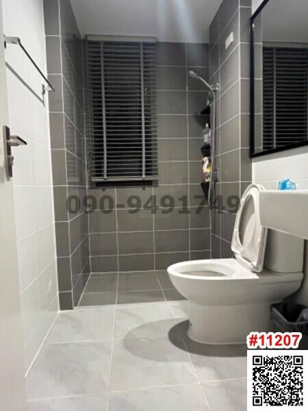 Modern bathroom interior with ceramic toilet and shower