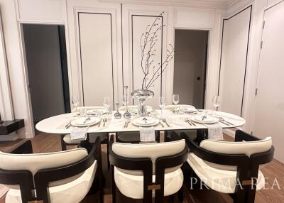 Elegant dining room with stylish tableware and modern chairs