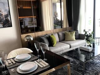 Stylish living room with modern decor and dinner table setup