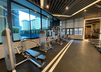 Modern gym interior with exercise equipment in a residential building