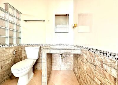 Modern bathroom with natural stone tiles