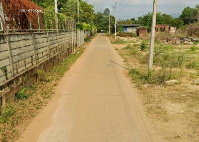 Rural street view with land plots
