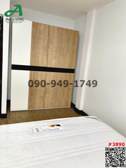 Compact bedroom with a large wardrobe