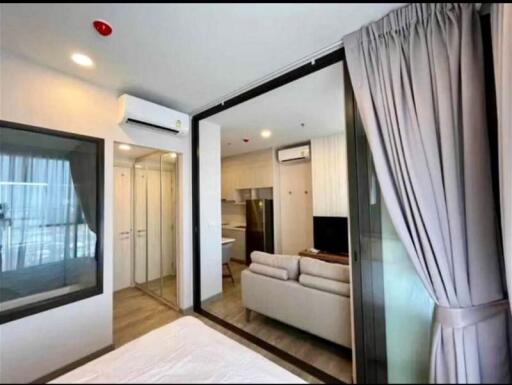 Modern bedroom with en-suite bathroom and open living area