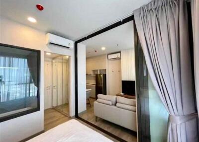 Modern bedroom with en-suite bathroom and open living area