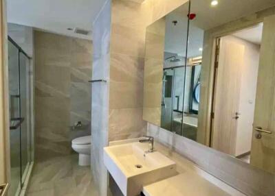 Modern bathroom interior with large mirror and sleek design