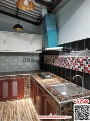 Contemporary kitchen with granite countertops and checkered tile backsplash