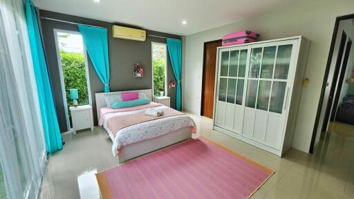 Bright and colorful bedroom with garden view